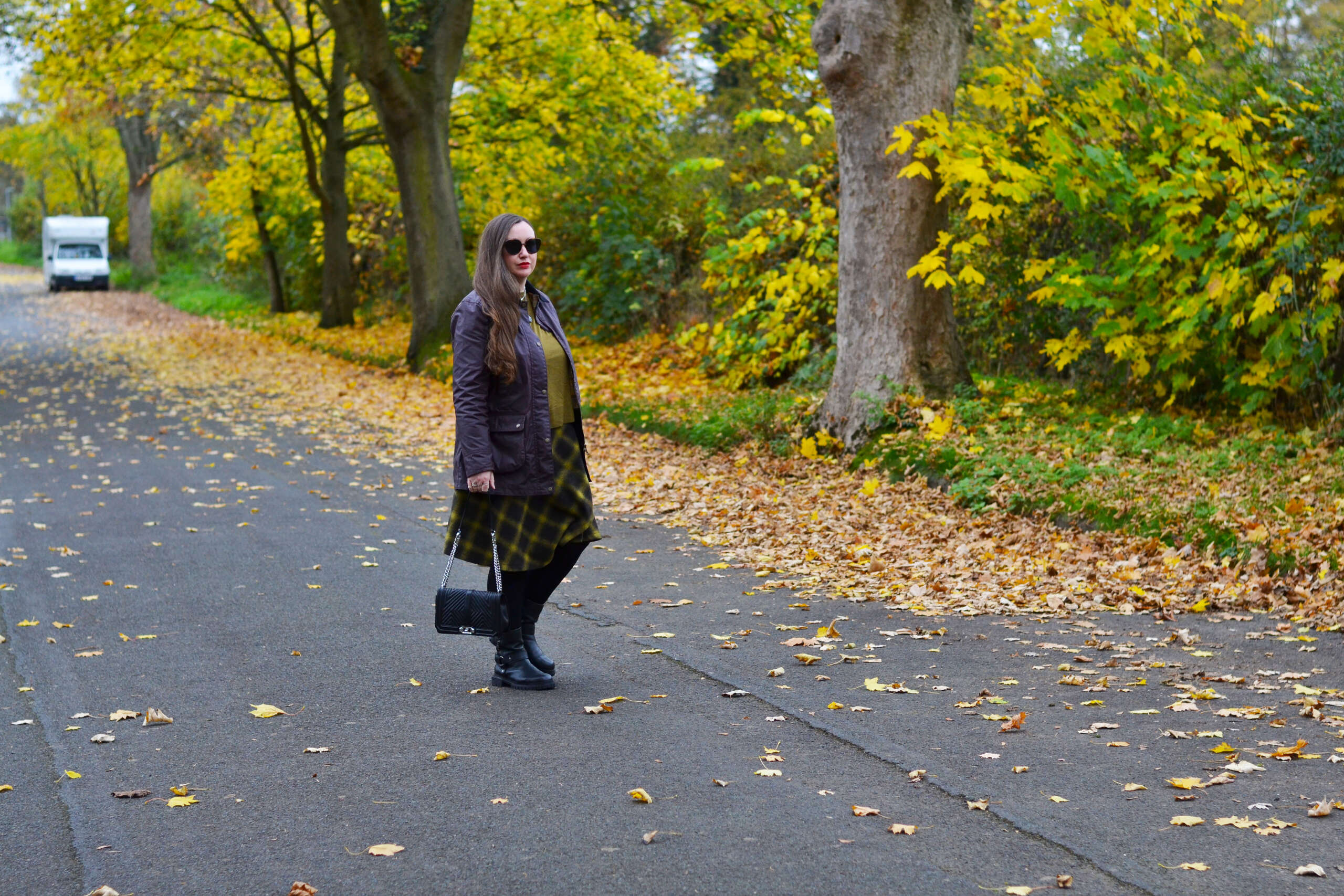 Barbour jacket with checked skirt and boots